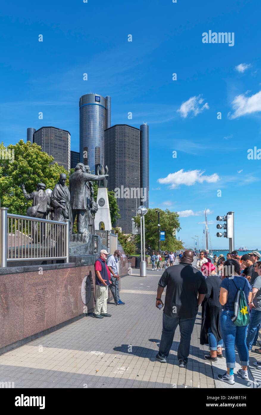 Tourists in front of  International Memorial to the Underground Railroad, with Renassance Center behind, Detroit Riverwalk, Detroit, Michigan, USA Stock Photo
