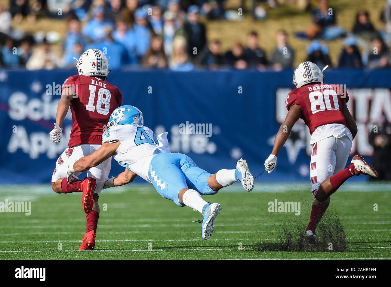 Annapolis, MD, USA. 27th Dec, 2019. Linebacker Jeremiah Gemmel (44) of the North Carolina Tar Heels tries to tackle wide receiver Jadan Blue (18) of the Temple Owls during the matchup between UNC Tar Heels and the Temple Owls at the Military Bowl at the Navy-Marine Corps Memorial Stadium in Annapolis, MD. Credit: csm/Alamy Live News Stock Photo