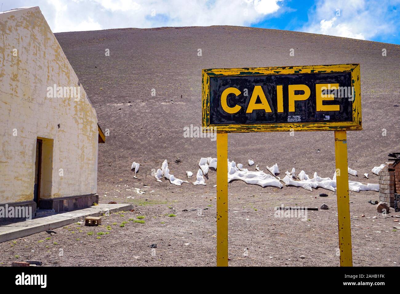 A wooden sign for Estacion Caipe (Caipe station) in the abandoned ghost