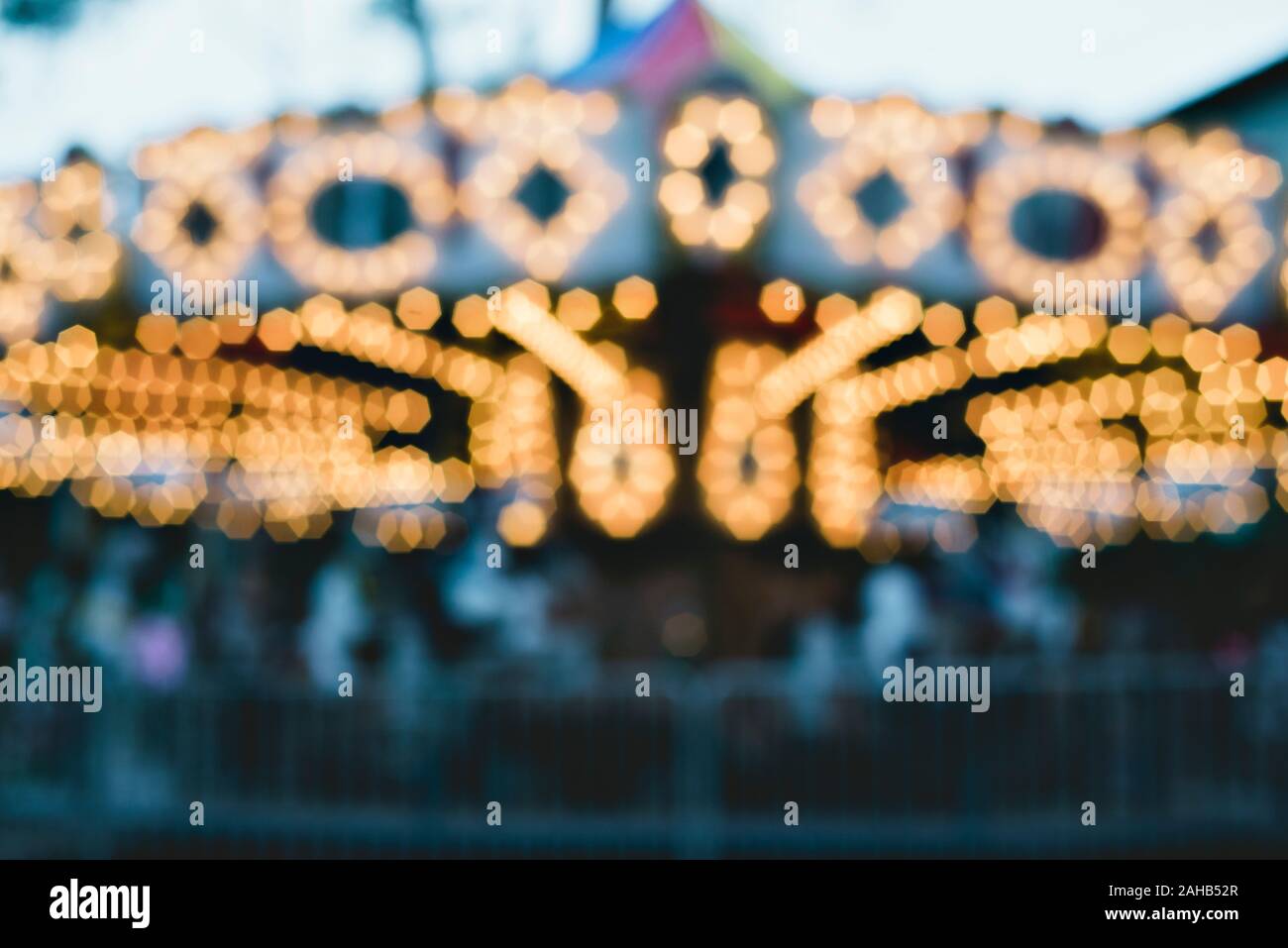 Carousel at night with blurred lighting.  Background concept - Abstract concept for winter fun Stock Photo