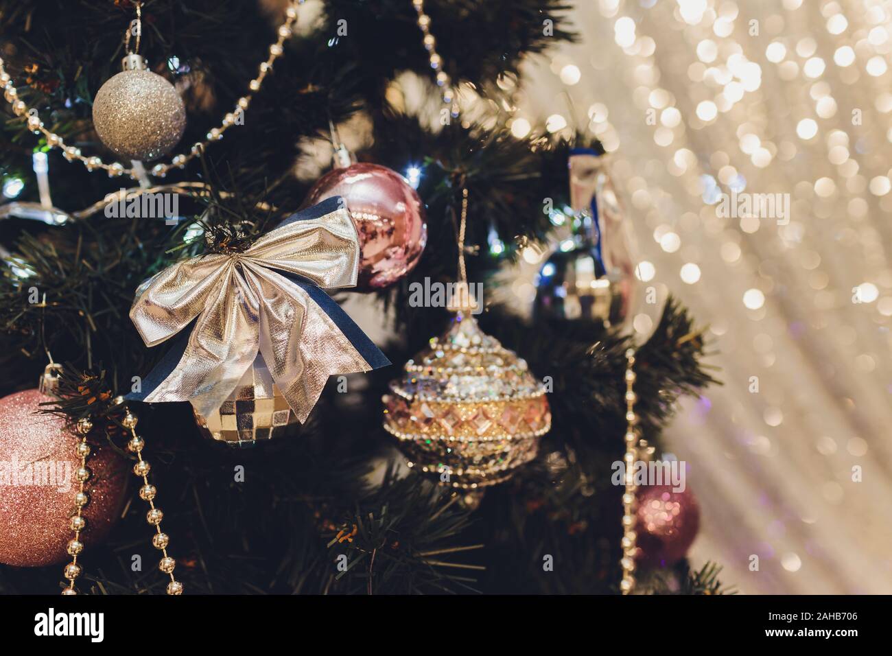 Christmas Tree With White And Black Gifts In The Bedroom