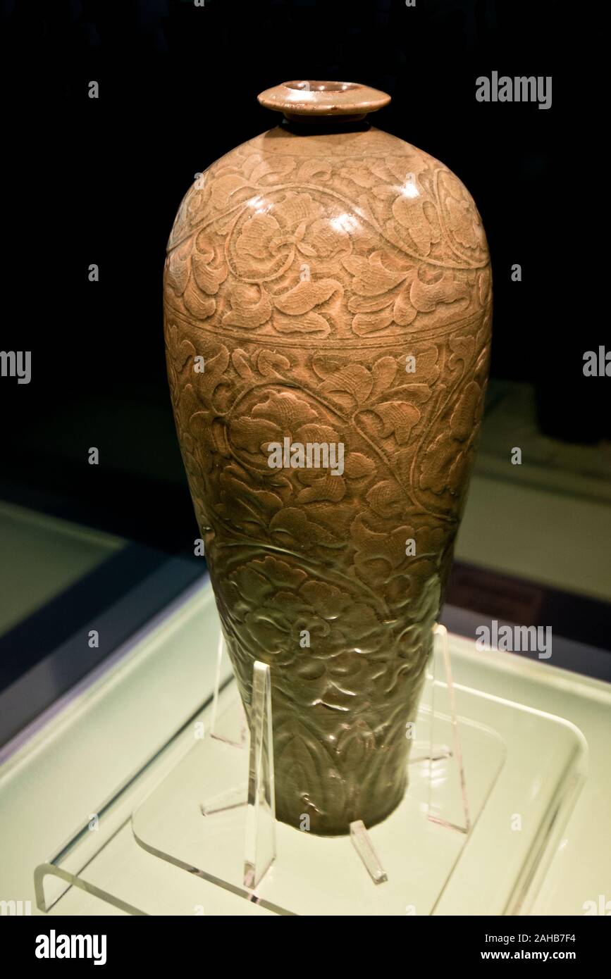 Chinese porcelain: Celadon meiping vase with carved peony design. Song Dynasty (A.D. 960-1127). Shanghai Museum, China. Stock Photo