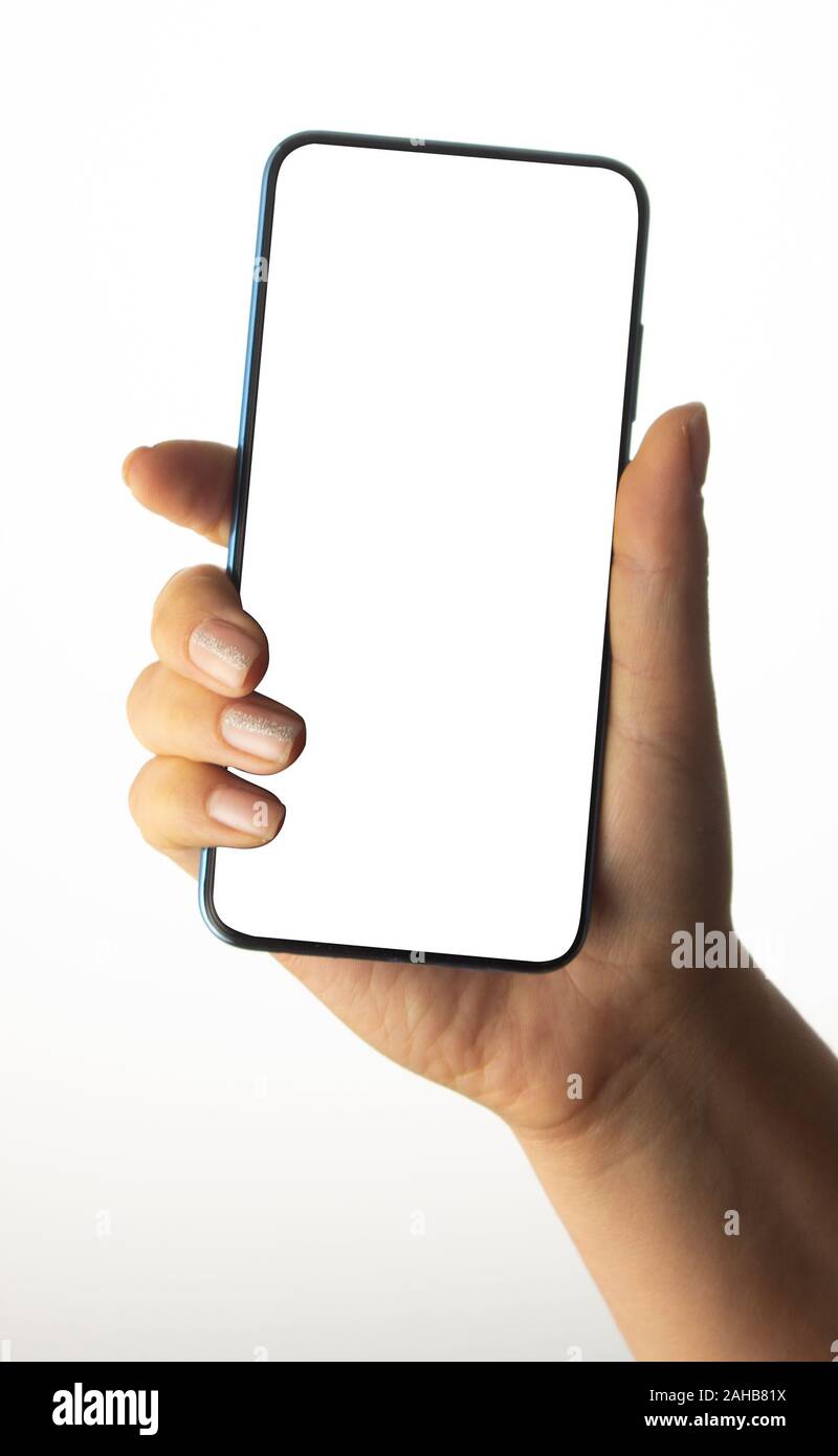 Hand holding black Smartphone with blank screen on white background ...