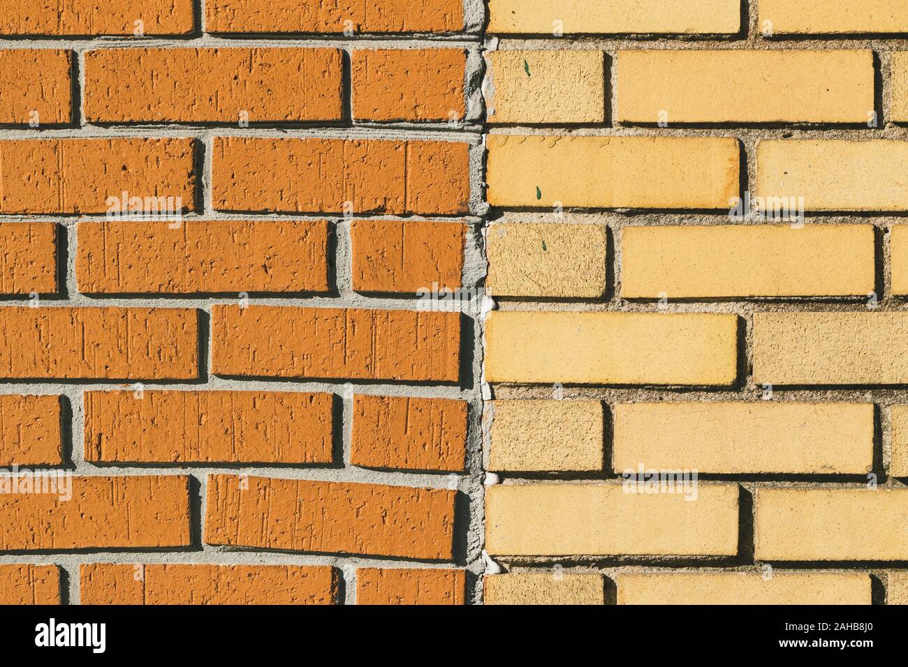 Vintage split color orange yellow brick wall background texture Stock ...