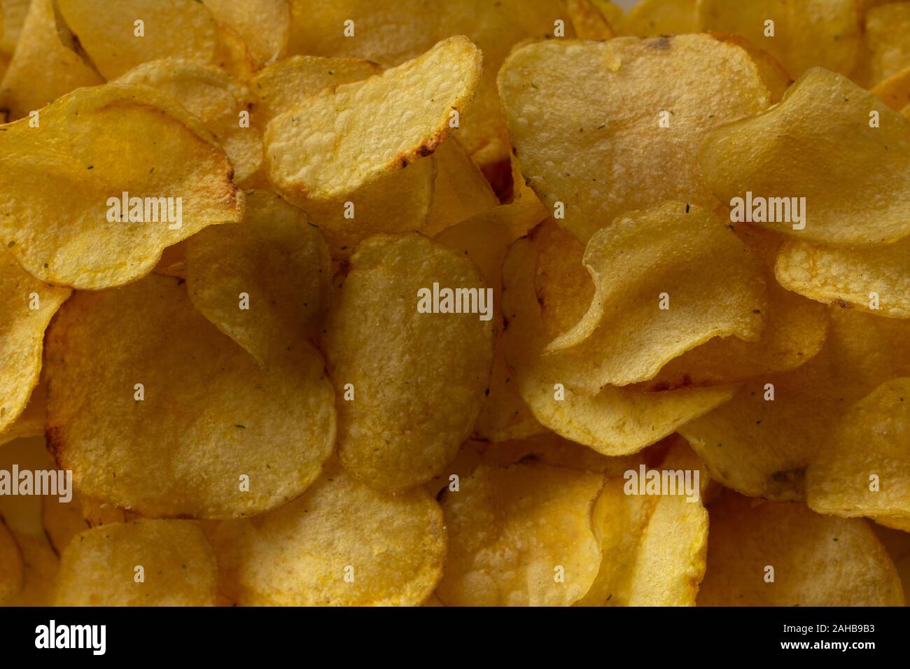 Texture fried golden brown potato chips, close-up Stock Photo