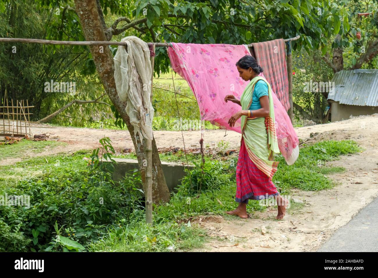 Woman walking barefoot street hi-res stock photography and images - Alamy