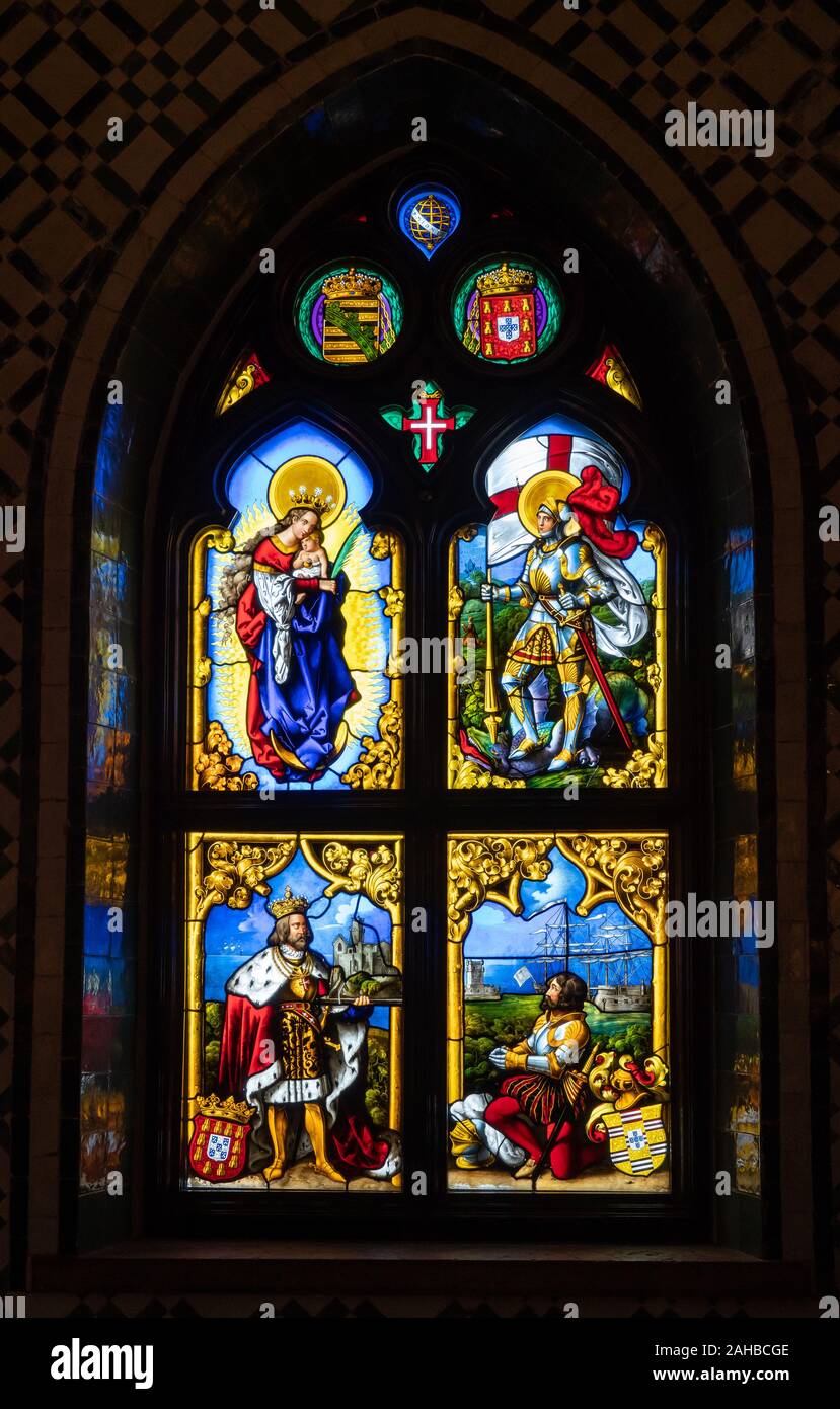 Sintra, Portugal - 21 August 2019: Colorful stained glass window in the Chapel of Our Lady of Pena at Pena Palace Stock Photo