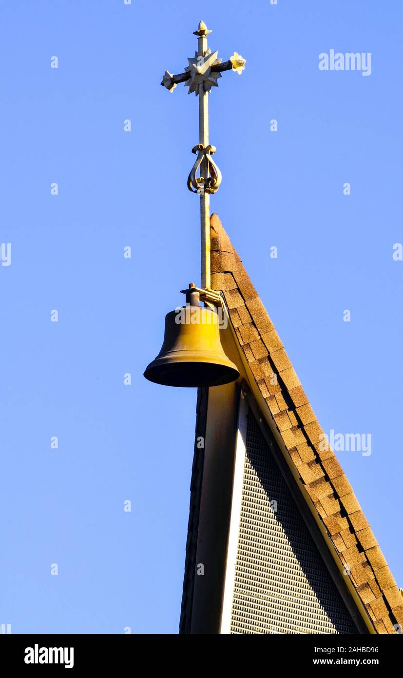 Steeple, bell and cross, St. Rose of Lima Catholic Church Crockett, 555 3rd Ave.,Crockett, CA 94525 Stock Photo