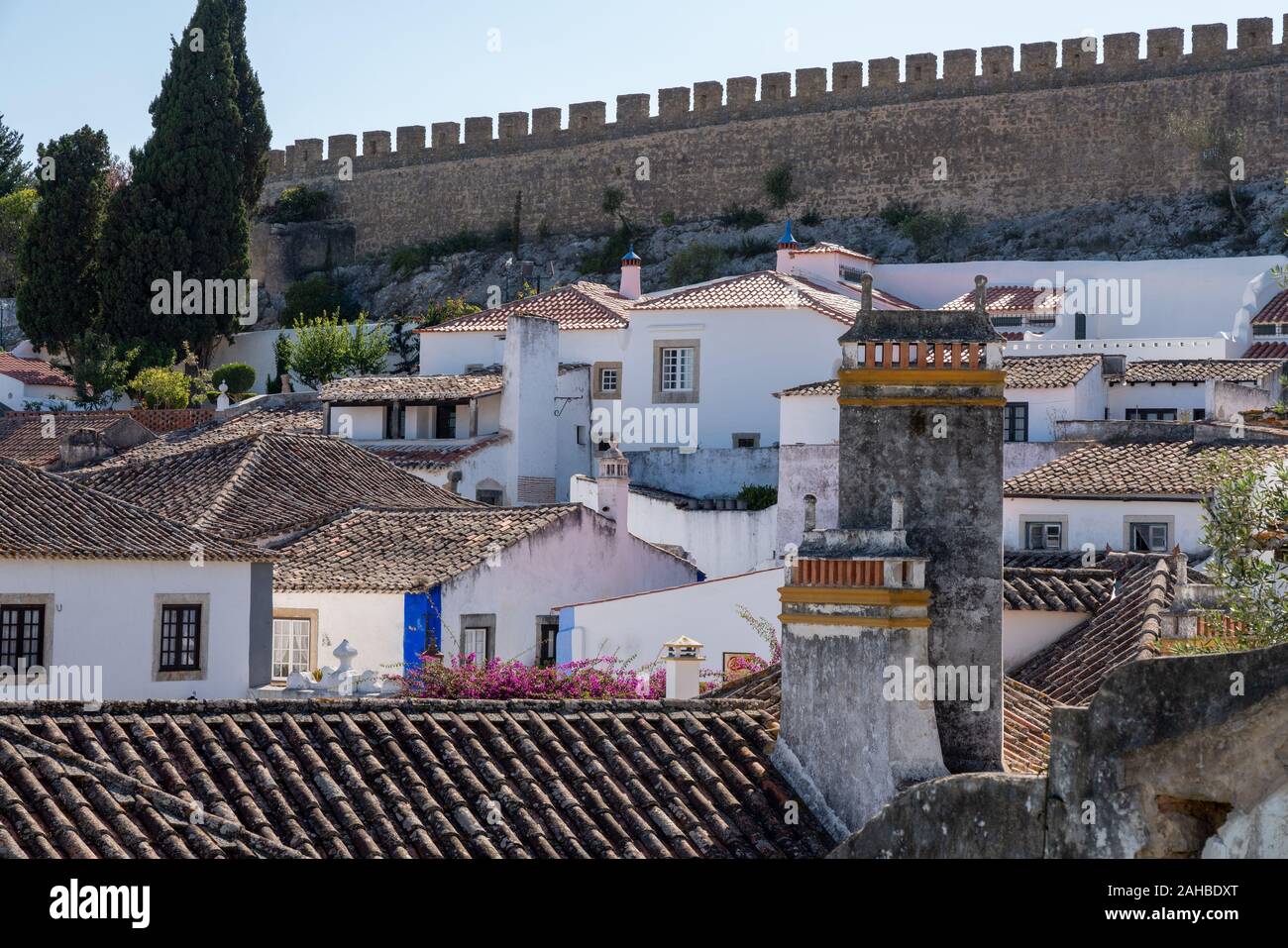 Rooftop view to the city walls in the old medieval city of Obidos in Portugal Stock Photo