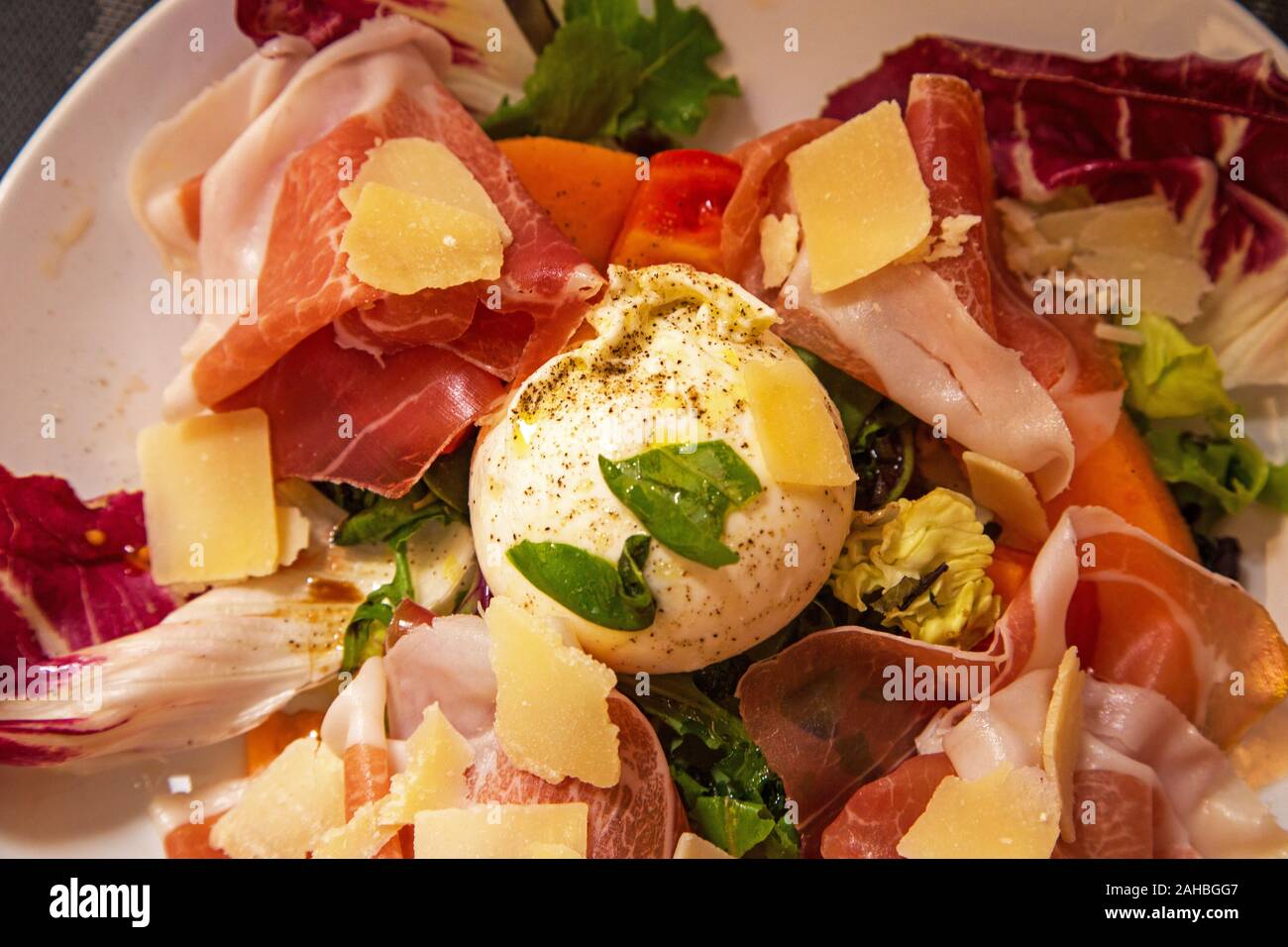 A plate of traditional meats and cheeses served in southern France Stock Photo