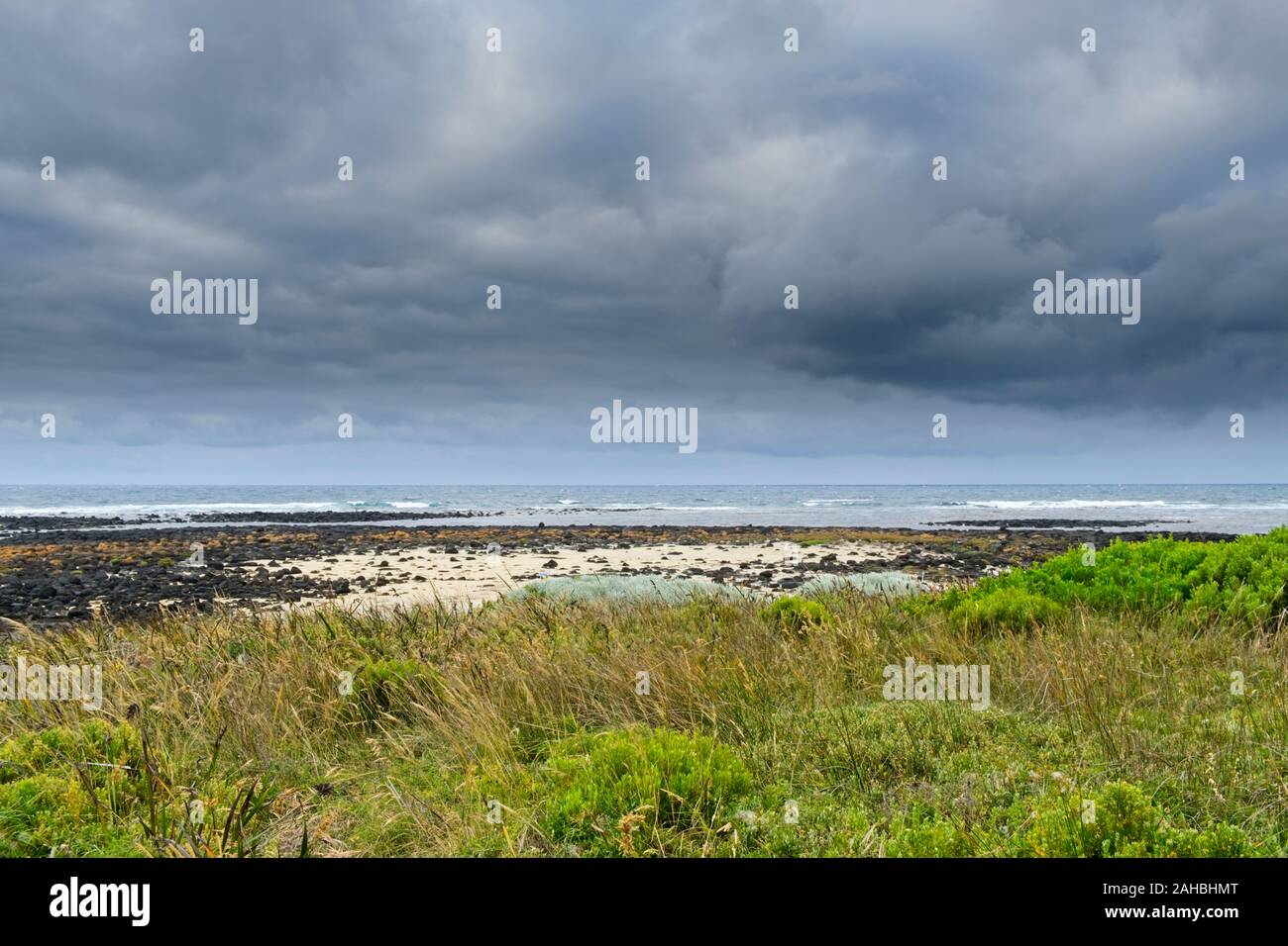 Grey clouds over Pea Soup/South Beach, Port Fairy Stock Photo