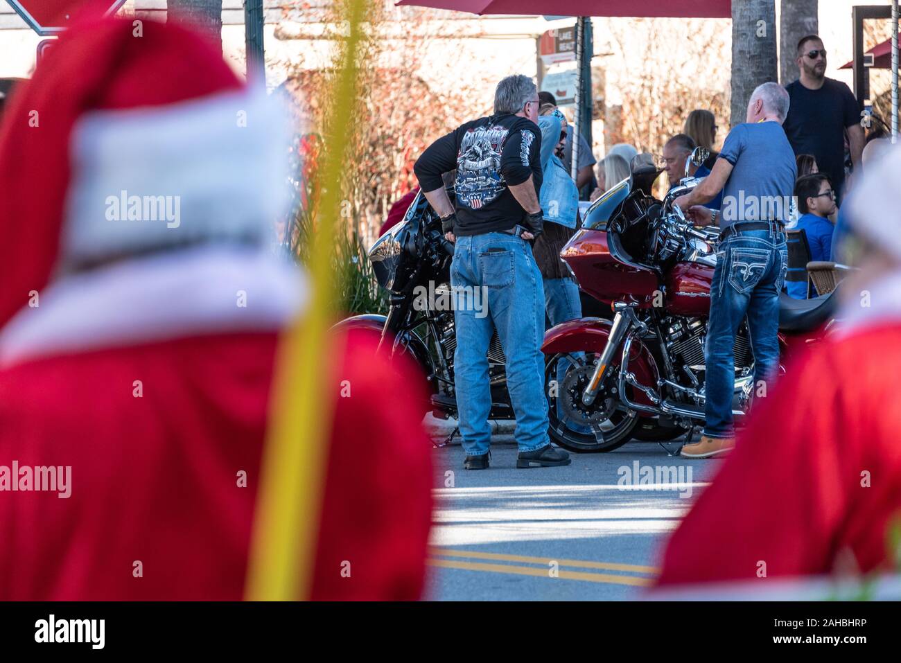Christmastime in Mount Dora, Florida with Mr. and Mrs. Santa Claus, along with senior bikers and their Harley-Davidson motorcycles. (USA) Stock Photo