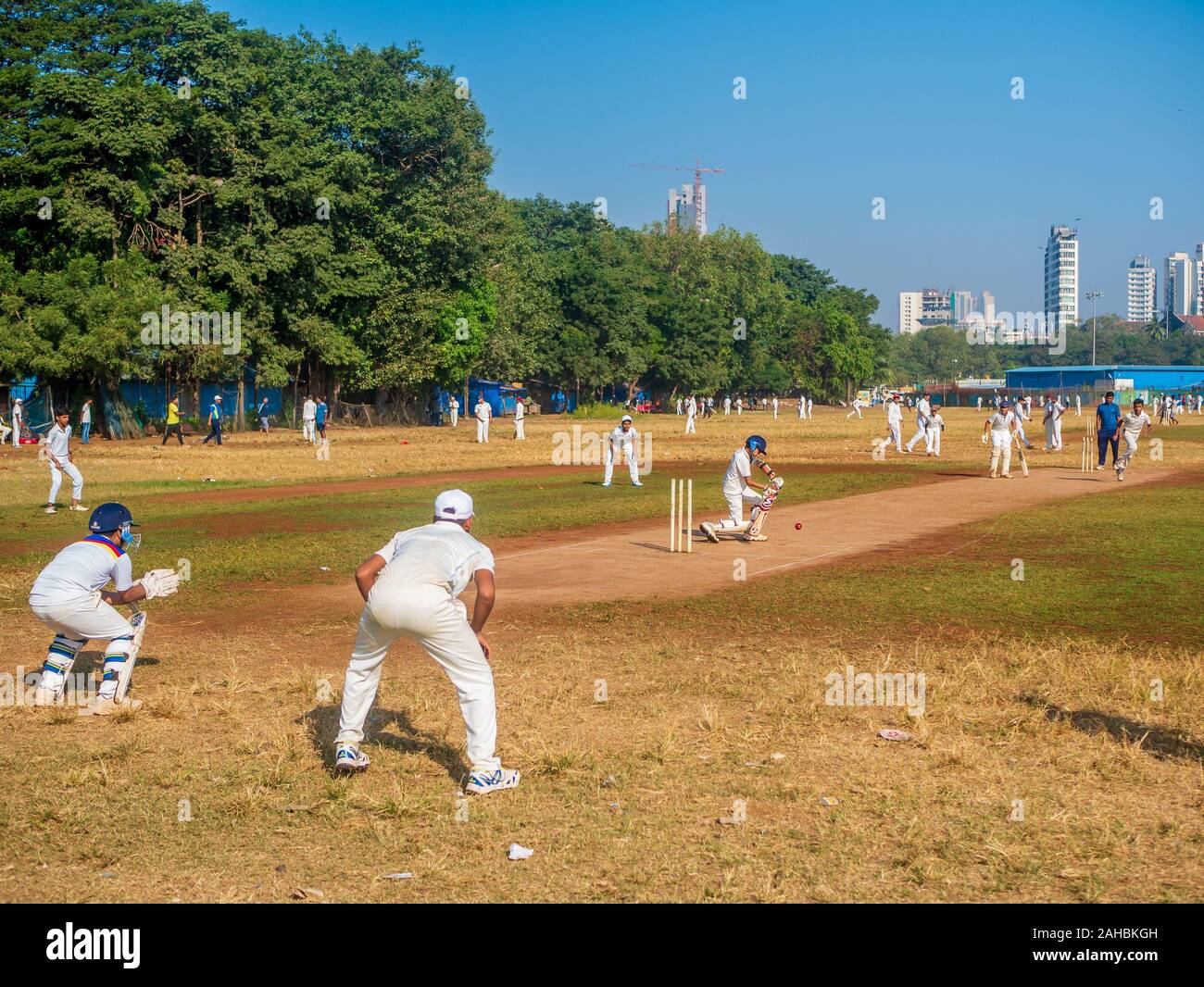 Mumbai, India - December 14, 2019: Indias most famous sport Cricket practiced by kids at local Mumbai ground Stock Photo