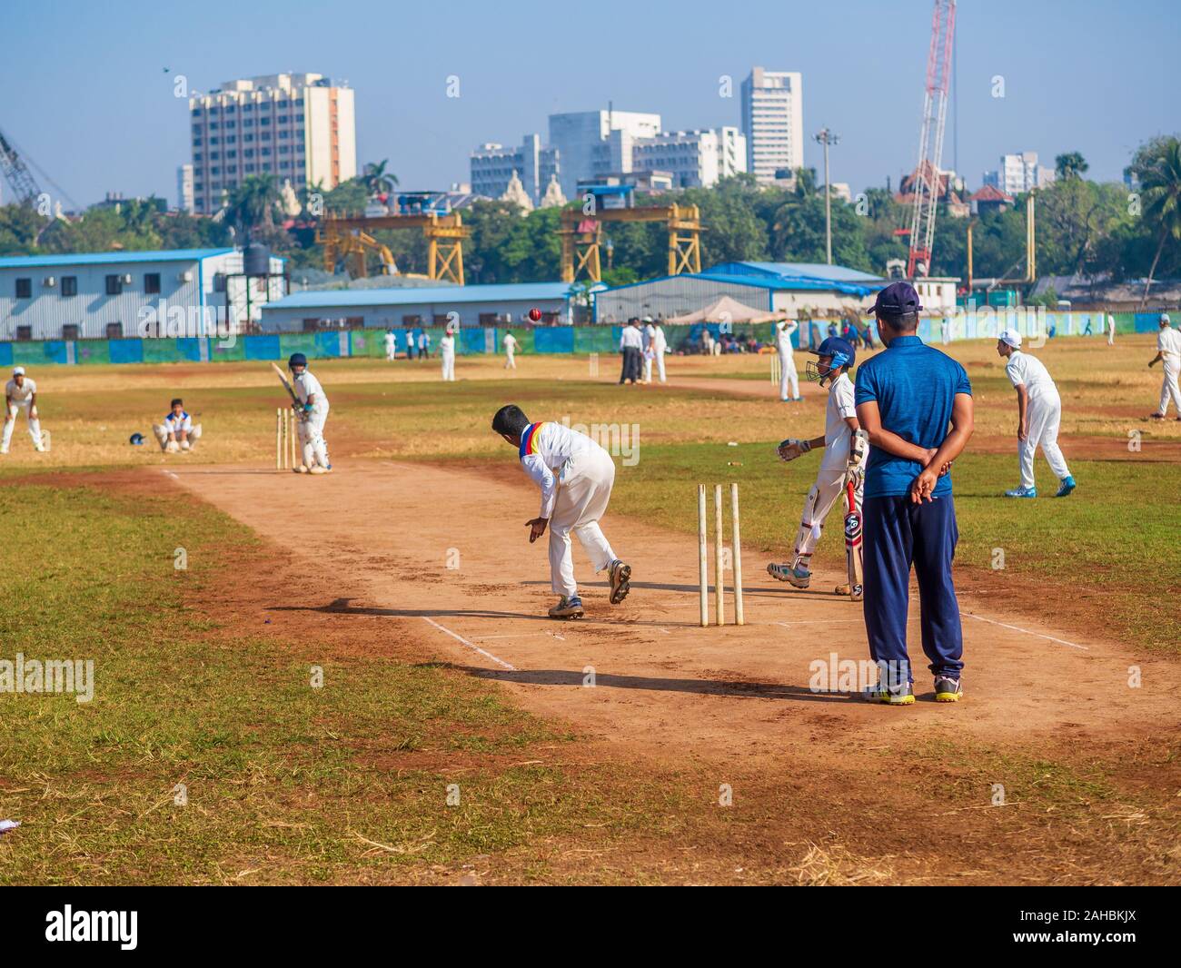Mumbai, India - December 14, 2019: Indias most famous sport Cricket practiced by kids at local Mumbai ground Stock Photo