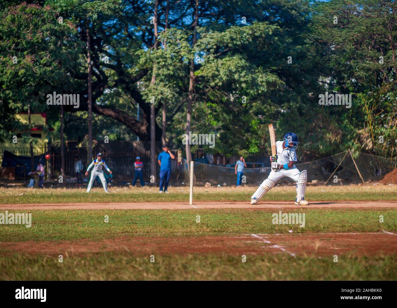 Mumbai, India - December 14, 2019: Indias most famous sport Cricket practiced by kids at local Mumbai ground Stock Photo