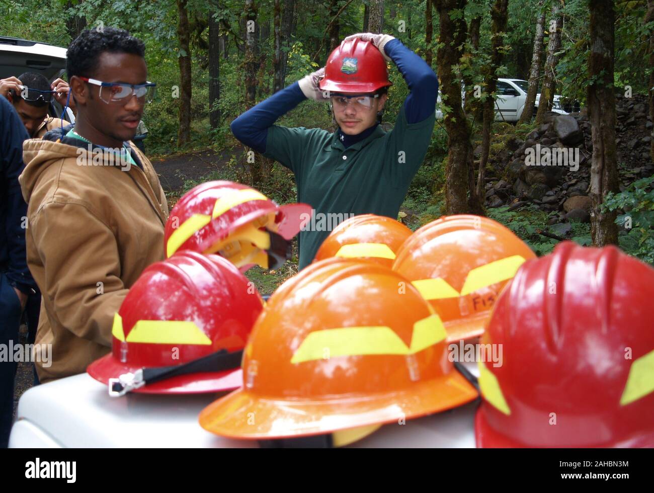 September 29, 2009. Estacada, OR. Timber Lake Job Corps Center students don safety equipment before heading out on a streamside restoration project on the Clackamas River. The project enhances the spawning areas of native salmon on the river. Stock Photo