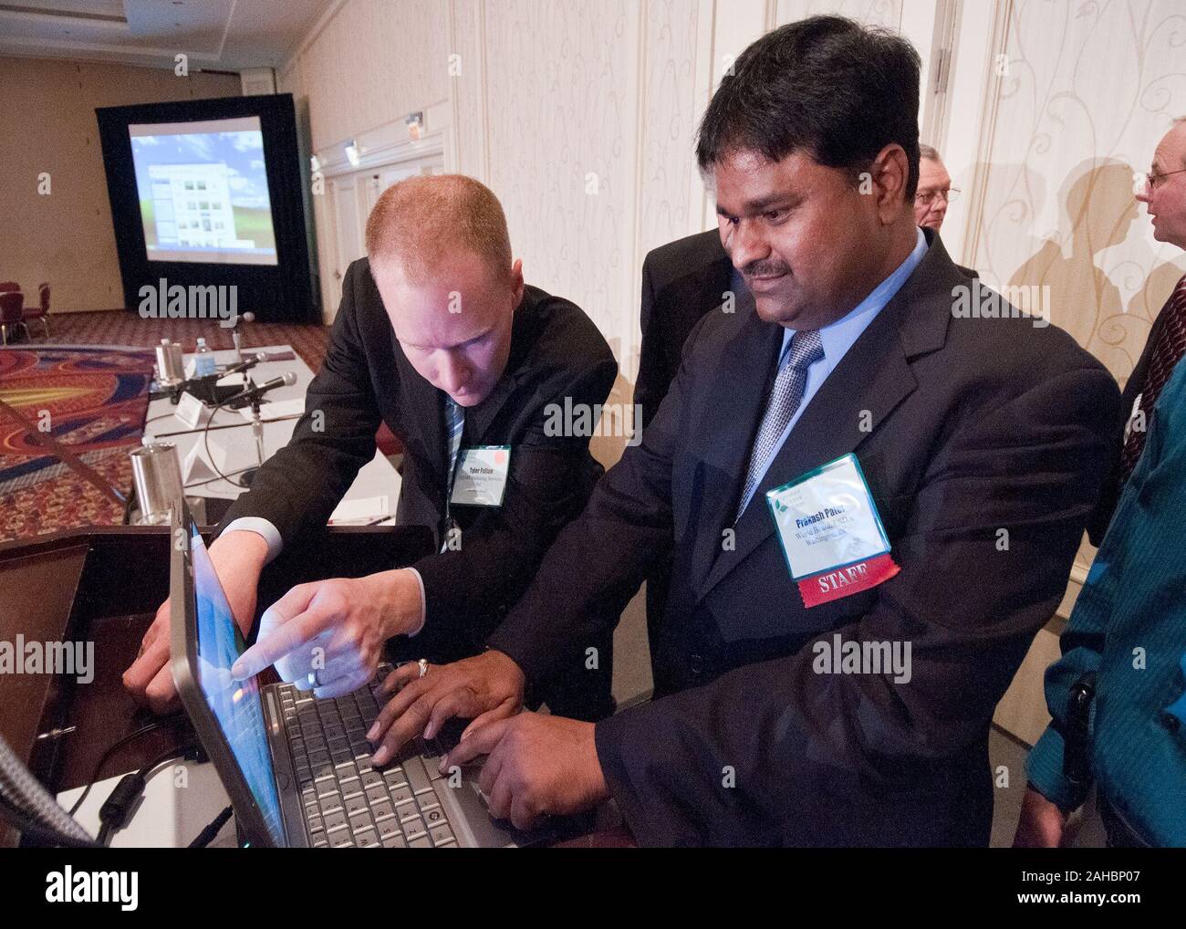 Prakash Patel, World Agricultural Outlook Board, United States Department of Agriculture loads Tyler Fulto'ns presentation  at the World Agricultural Outlook Forum in Crystal City, Virginia, February 25, 2011. Stock Photo