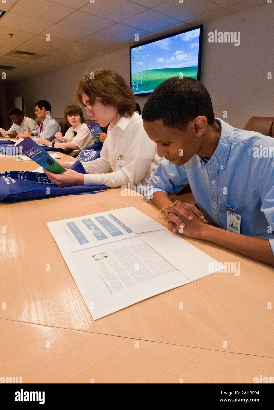 Nebil Maeruf, David Bellomy, Patrick Lehan, Moshin Khan Springbrook High School, Silver Spring, Maryland and David Thompson, Eleanor Roosevelt High School, Greenbelt, Maryland, members of the Academy of Information Technology review literature for the United States Department of Agriculture, Information Technology Job Shadow Day Wednesday, April 13, 2011. USDA holds an Information Technology Job Shadow Day annually. It is an opportunity for students from local high schools to learn the breadth and depth of information technology at USDA and how it is applied the department. Students toured the Stock Photo