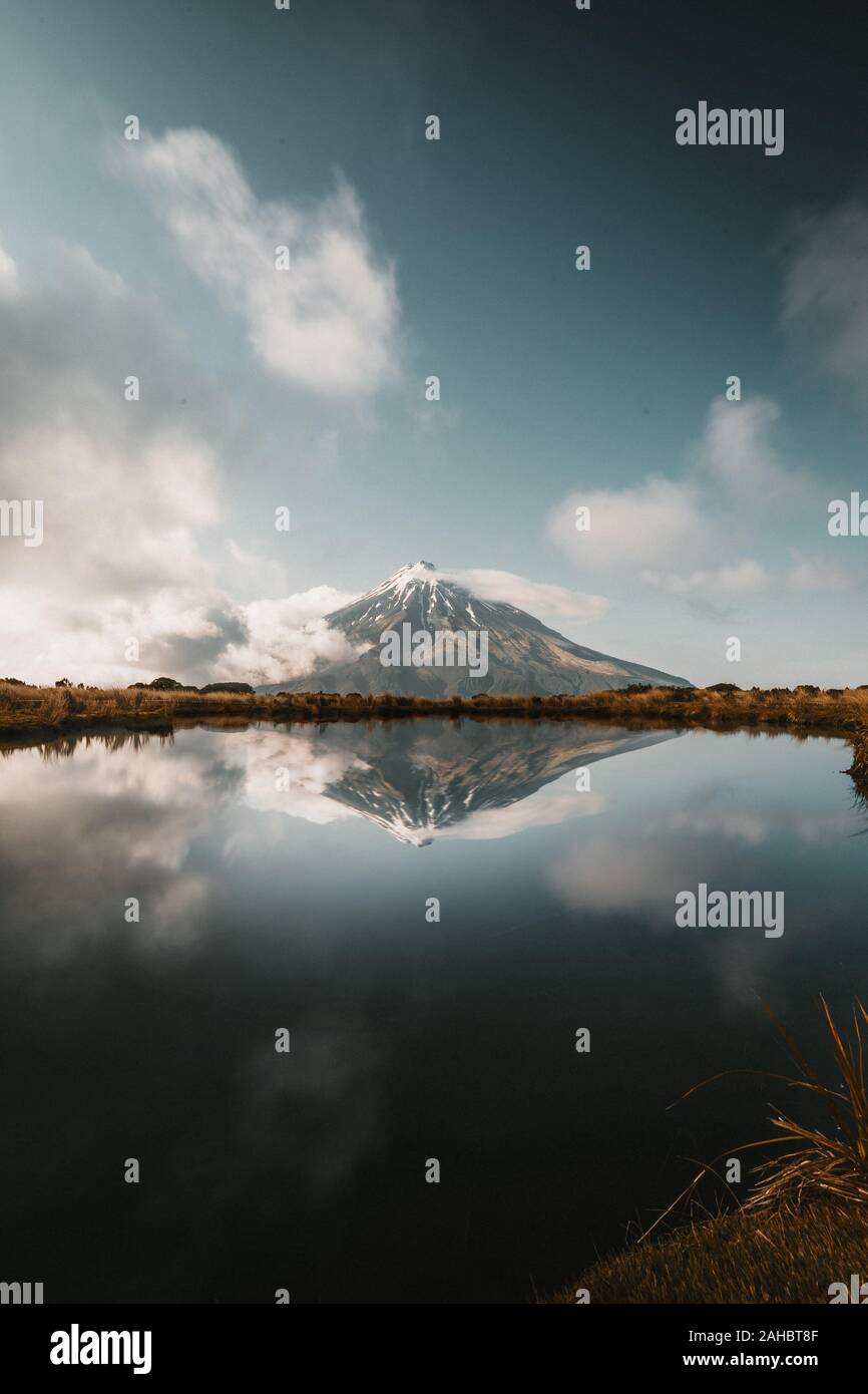 Mirror Lake with Mount Taranaki Volcano New Zealand Stock Photo