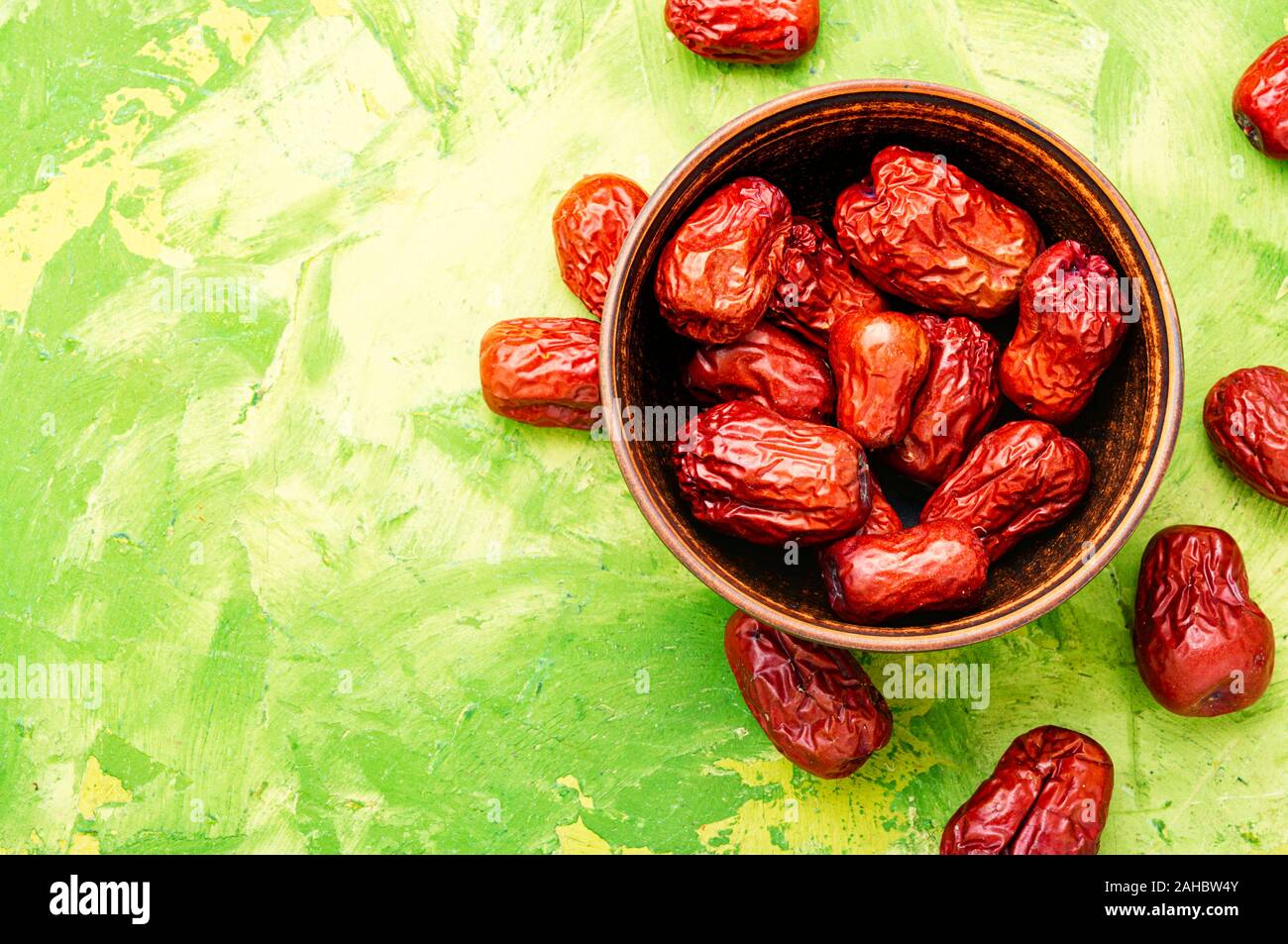 Bowl of dried unabi fruit or jujube.Space for text Stock Photo