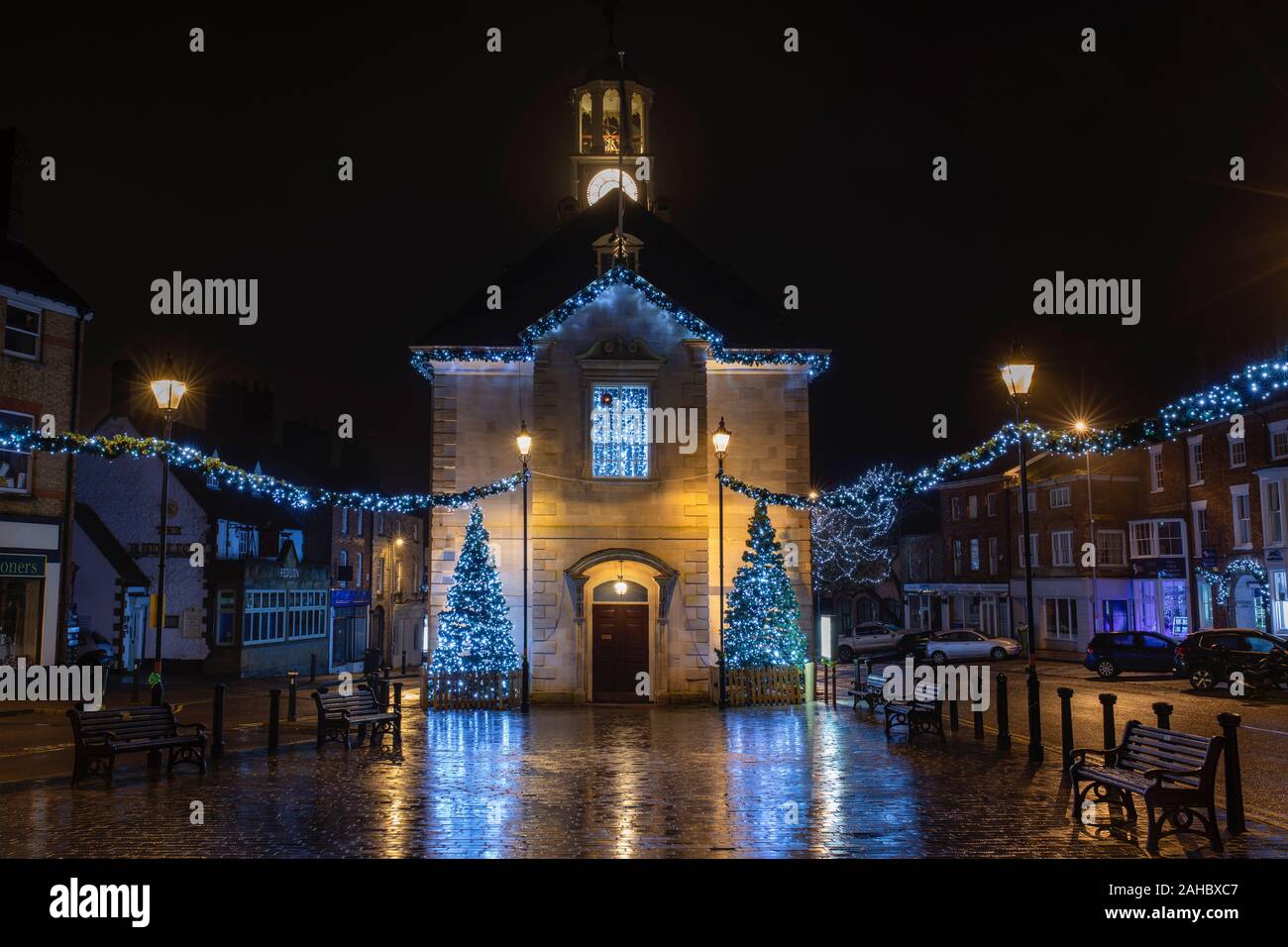 Christmas trees and lights outside brackley town hall in the early morning after the rain. Brackley, Northamptonshire, England Stock Photo