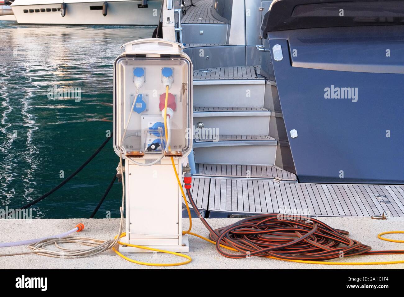 Electrical outlets for charging on boats in sea coast in Mediterranean