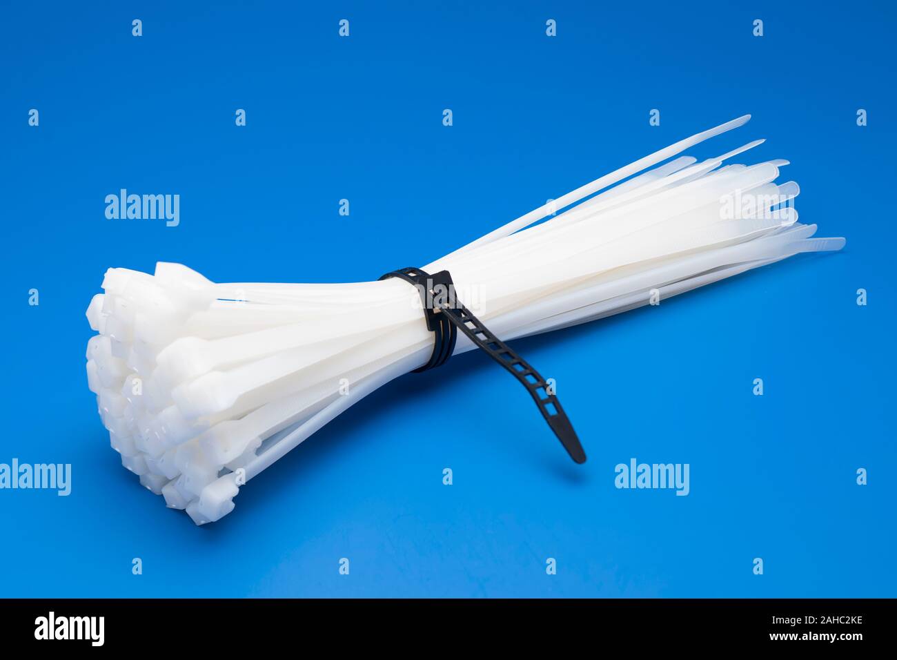 Bundle of long white cable ties Stock Photo