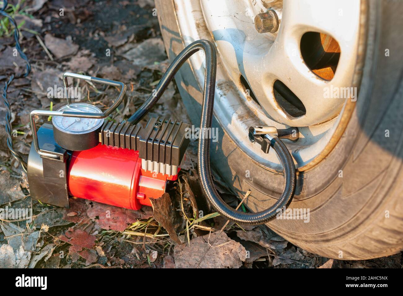 Car tire inflate with compressor Stock Photo