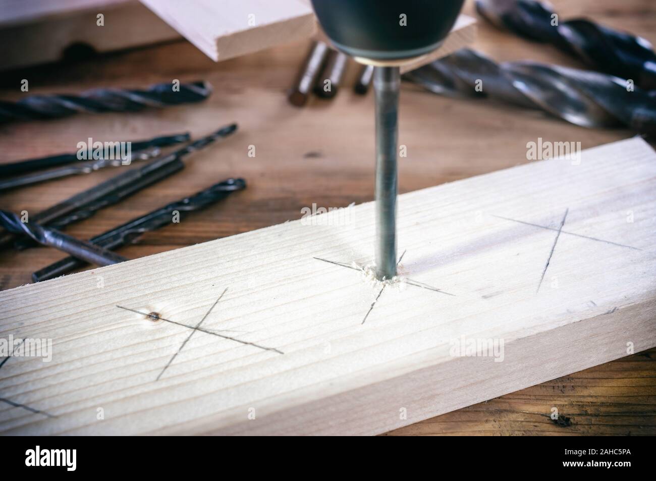 Drill work. Making hole into the wood with drill bit Stock Photo Alamy