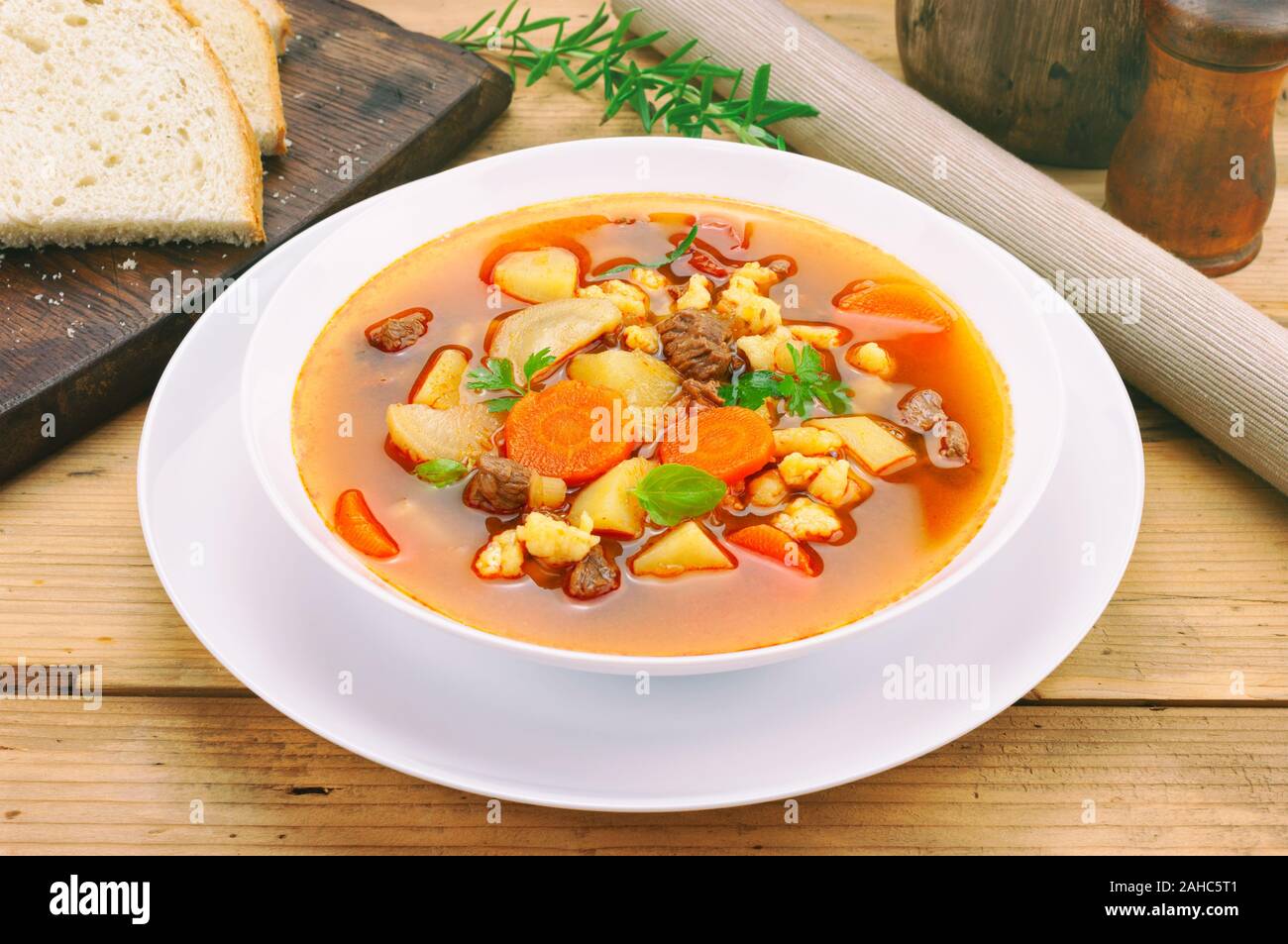 Goulash soup on wooden table Stock Photo