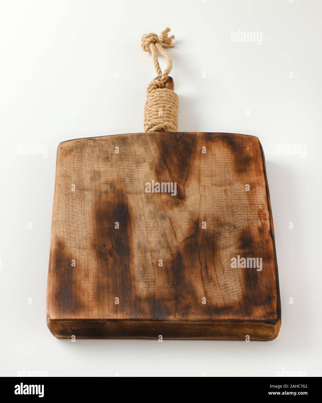 Rustic wooden cutting or serving board with handle Stock Photo Alamy