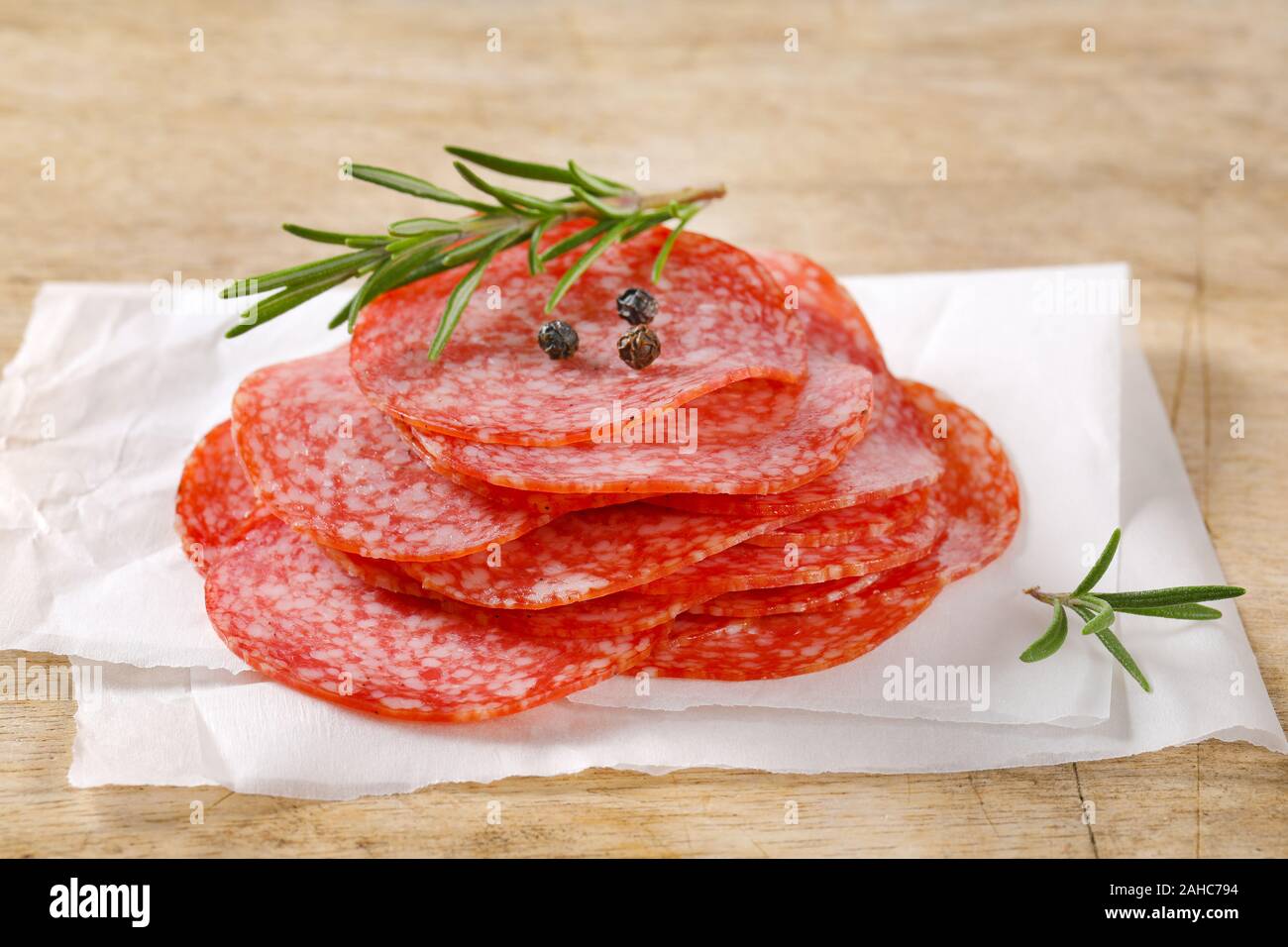 Download Sliced Salami Sausage On White Wax Paper Stock Photo Alamy Yellowimages Mockups