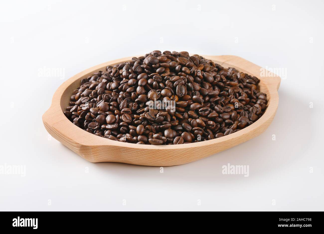 Roasted coffee beans on wooden tray Stock Photo