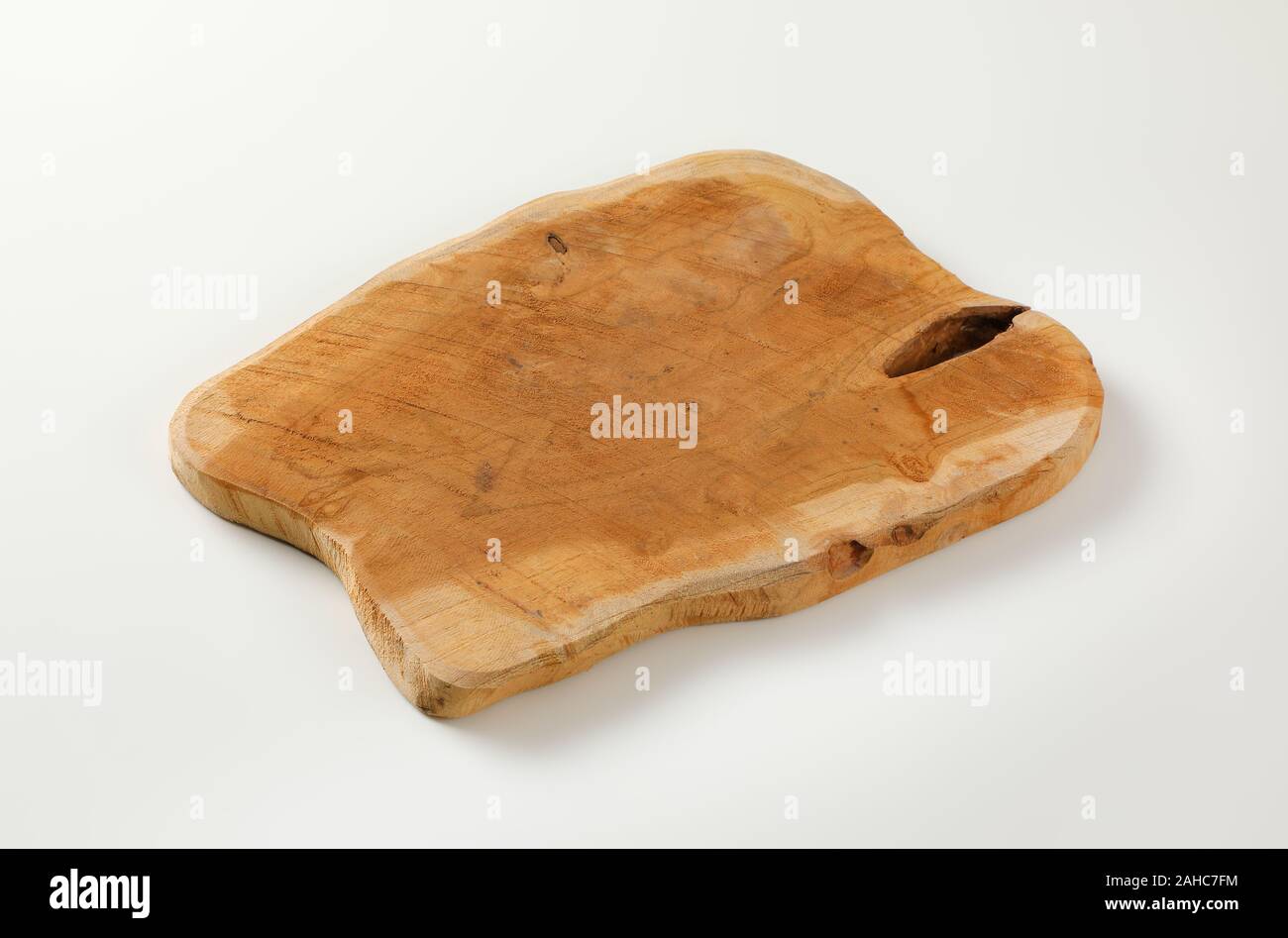 Live edge wooden cutting or serving board Stock Photo