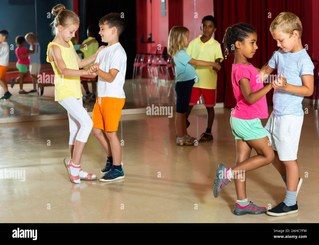 Group of kids dancing salsa dance in modern studio Stock Photo Alamy