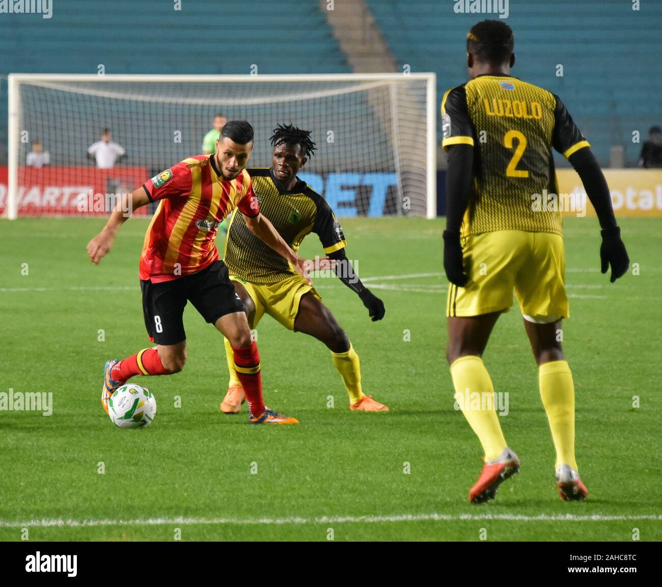 Rades, Tunisia. 27th Dec, 2019. Esperanc's Player Anice Badri and AS V.club  player Avandogo Luete Mustafa are seen in action during the CAF Champions  League 2019 - 20 football match between Esperance