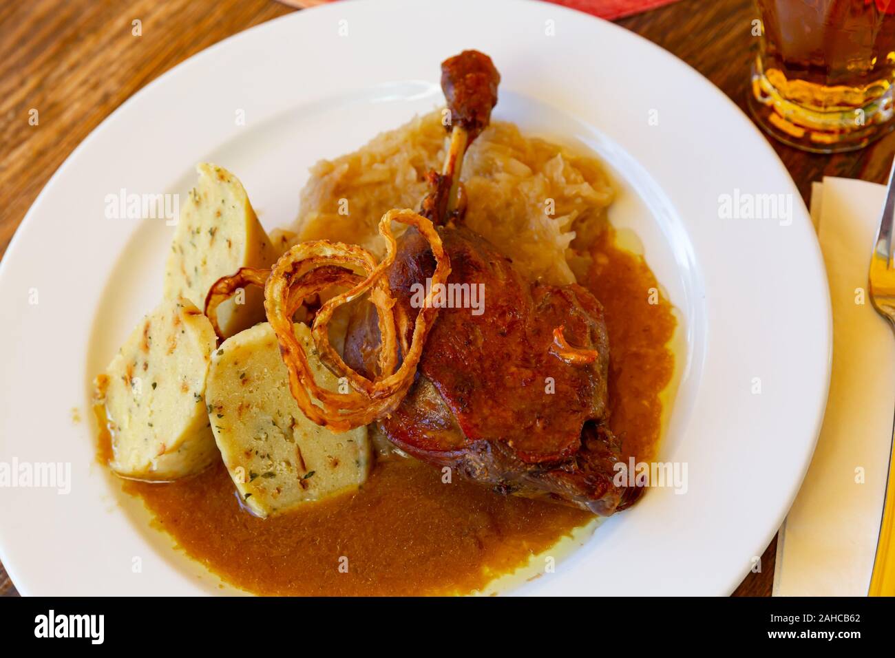 Czech cuisine,confit duck leg with potato dumplings, sauerkraut and