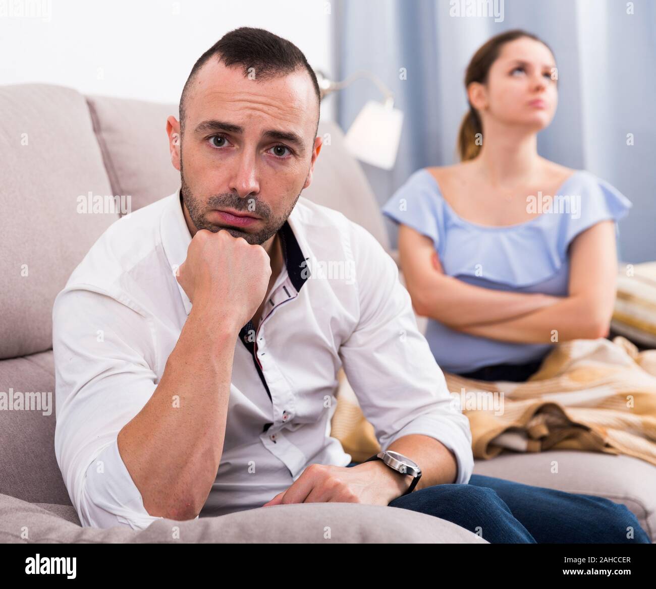 Sad male is depressing and husband is supporting him at home. Stock Photo