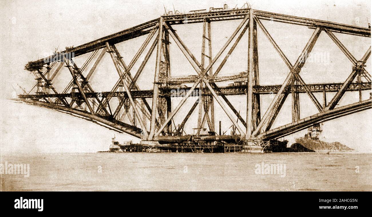 A late Victorian photograph of the building  of the the Forth Bridge, Scotland - One of the 3 cantilevers being constructed .Construction started 1882 and it was opened on 4 March 1890 by the Duke of Rothesay, the future Edward VII. On opening it was the longest single cantilever bridge span in the world (now the second) Stock Photo