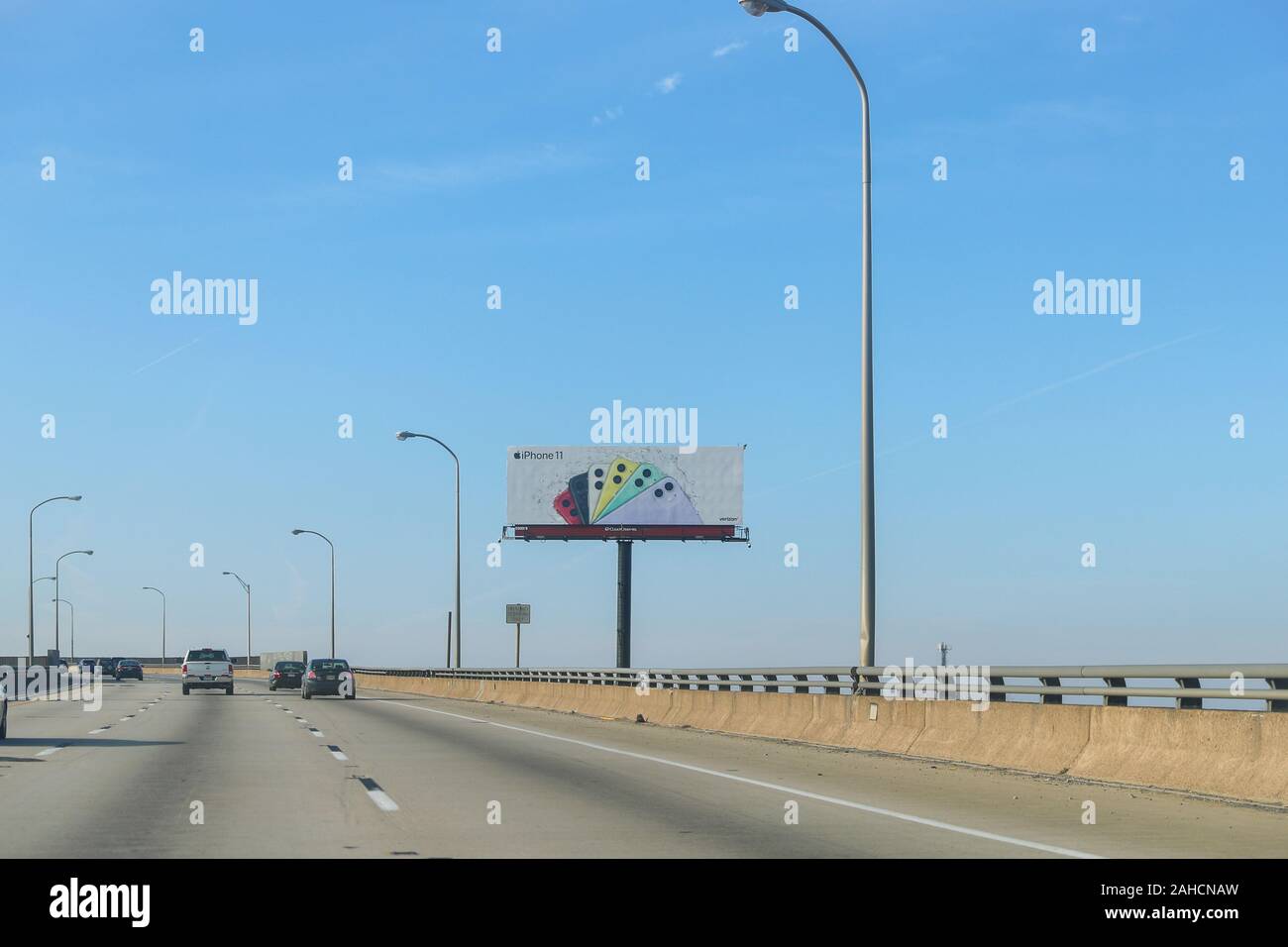New Jersey December 26, 2019: A billboard advertising the iPhone 11 pro which on the highway - Image Stock Photo