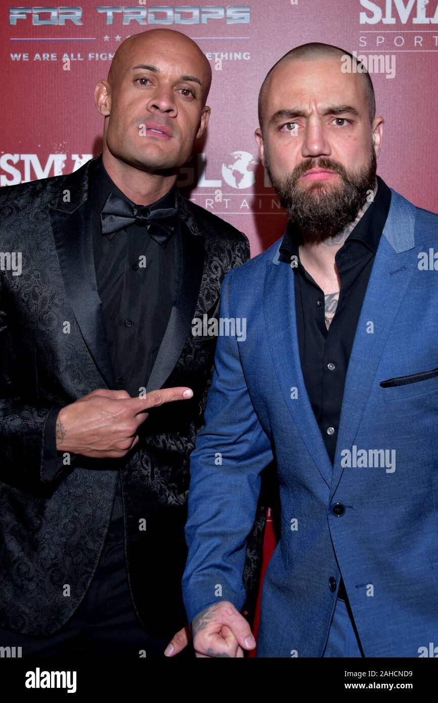 HOLLYWOOD, CA - DECEMBER  19:  Producer Steve Orosco and Taylor Ramsdell arrives for the SMASH GLOBAL IX Fight Night  on December 19, 2019 2019 in Hol Stock Photo