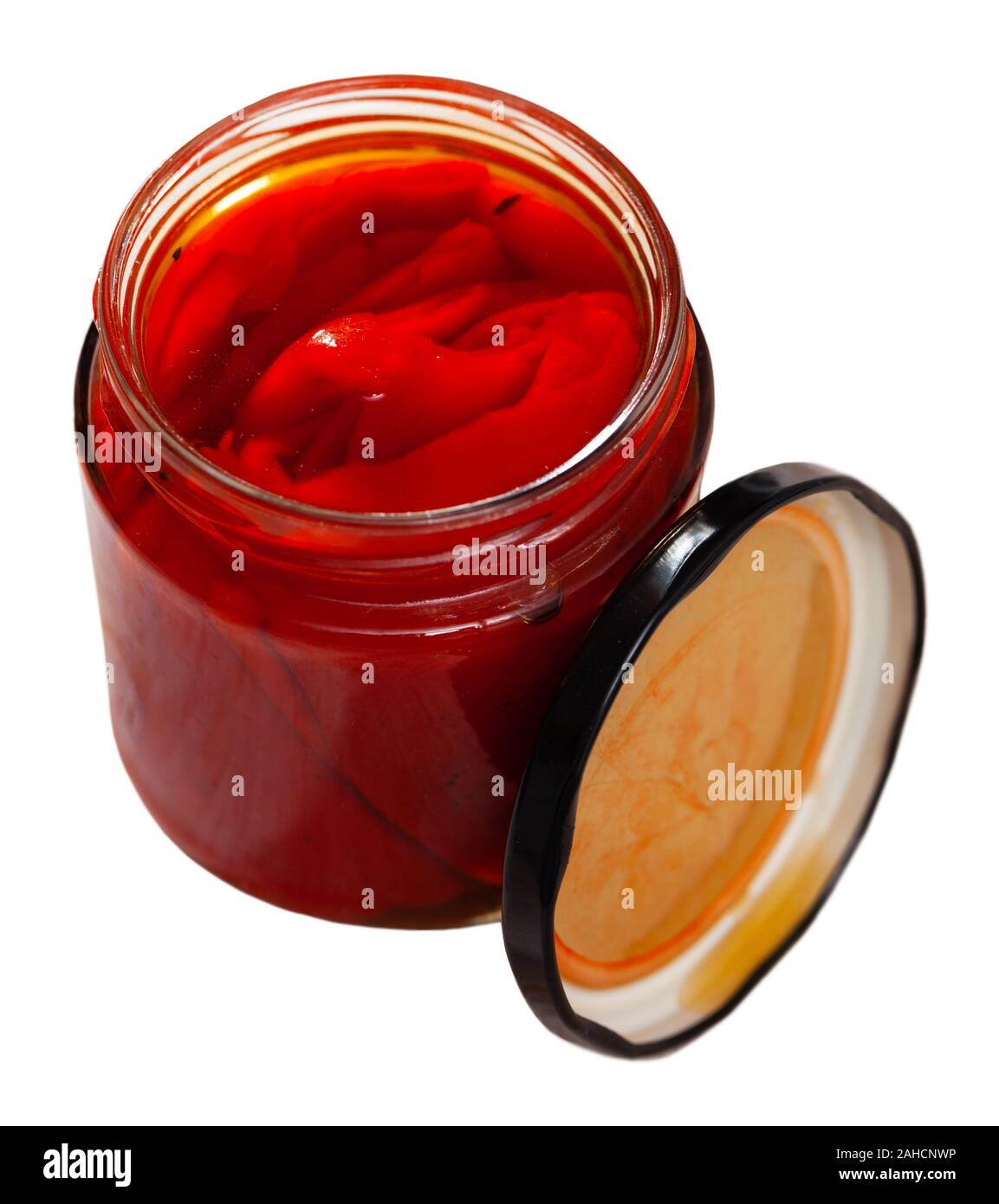 Pickled peppers in a glass jar. Isolated over white background Stock