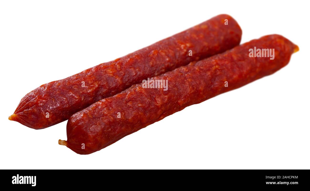 Appetizing Tyrolean hunter sausages traditionally lightly smoked over beech wood and dried in air. Isolated over white background Stock Photo