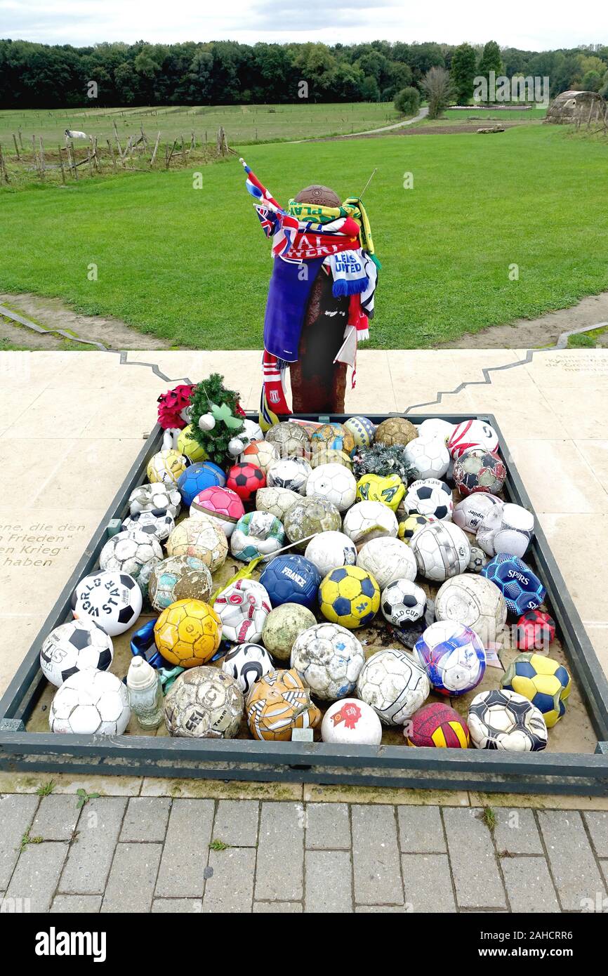 People leave footballs and club mementoes at the UEFA memorial to the 1914 Christmas truce and football matches between British and German soldiers Stock Photo