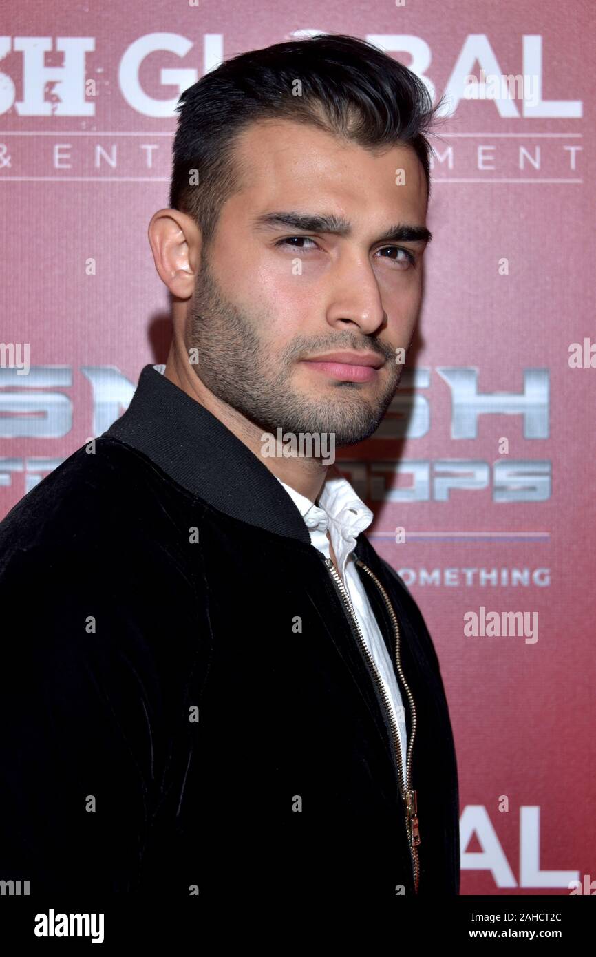 HOLLYWOOD, CA - DECEMBER  19:  Actor Sam Asghari arrives for the SMASH GLOBAL IX Fight Night  on December 19, 2019 2019 in Hollywood California. (Phot Stock Photo