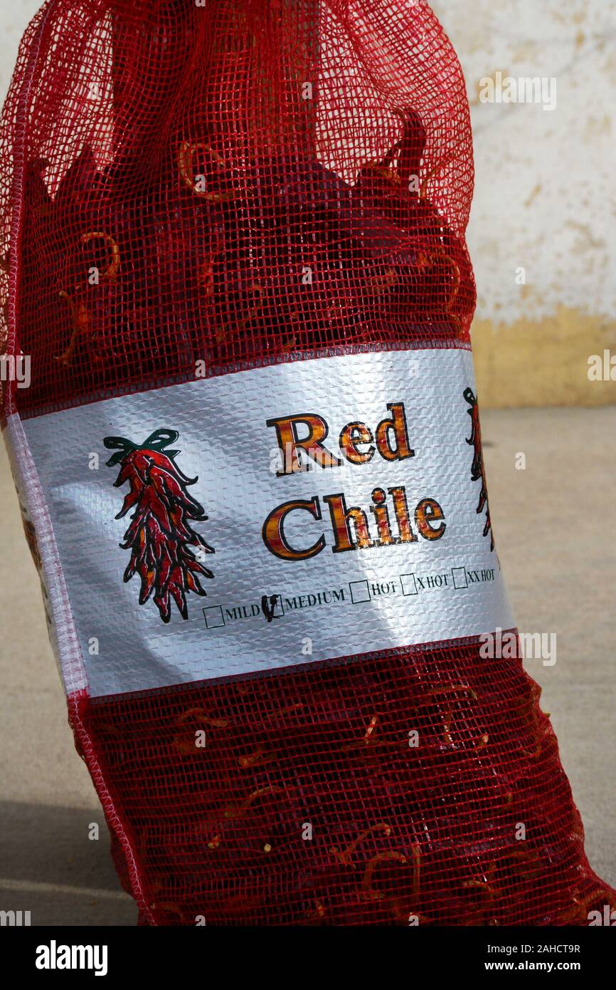 Bags of red Chile peppers available for purchase in a store adjacent to