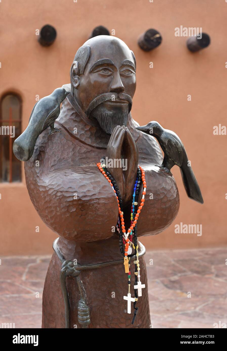 A statue of St. Francis of Assisi at the historic Santuario de Chimayo church and pilgrimage site in Chimayo, New Mexico USA. Stock Photo