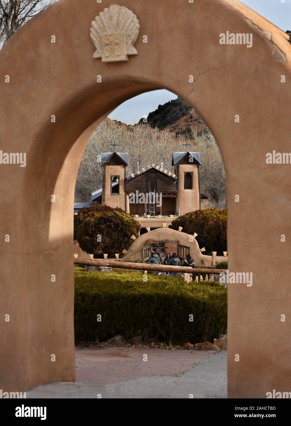 Visitors enter the Santuario de Chimayo, an historic Catholic church and hispanic pilgrimage