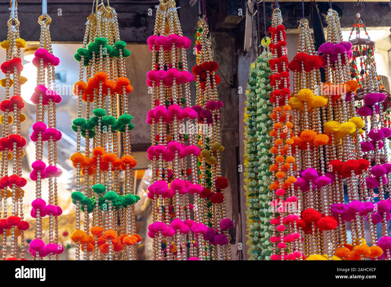 Colorful hanging decorations on display for sale in Chandi Chowk Old Delhi. Stock Photo