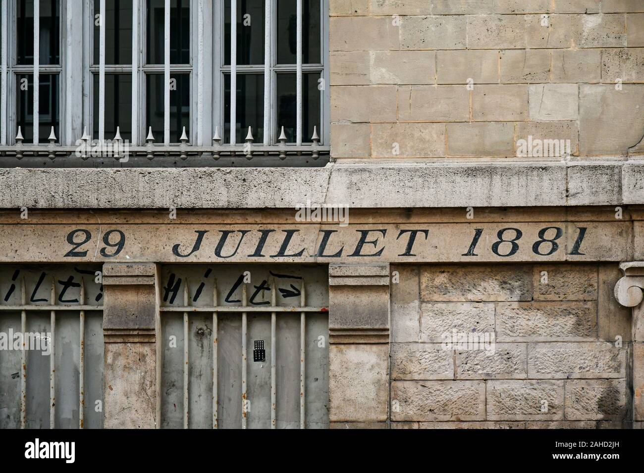 Close-up of the stone wall of an old building in the centre of Paris with the date of the French law on freedom of the press, July 29 1881, France Stock Photo